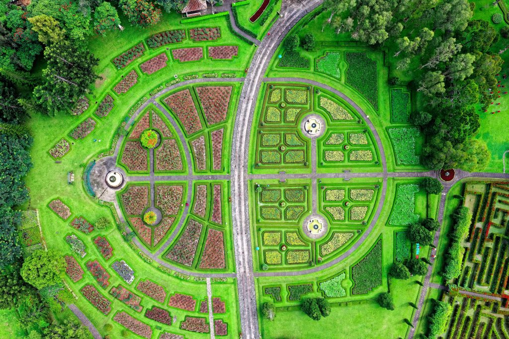 Aerial shot of a vibrant, symmetrical garden layout in Sukaresmi, Indonesia.