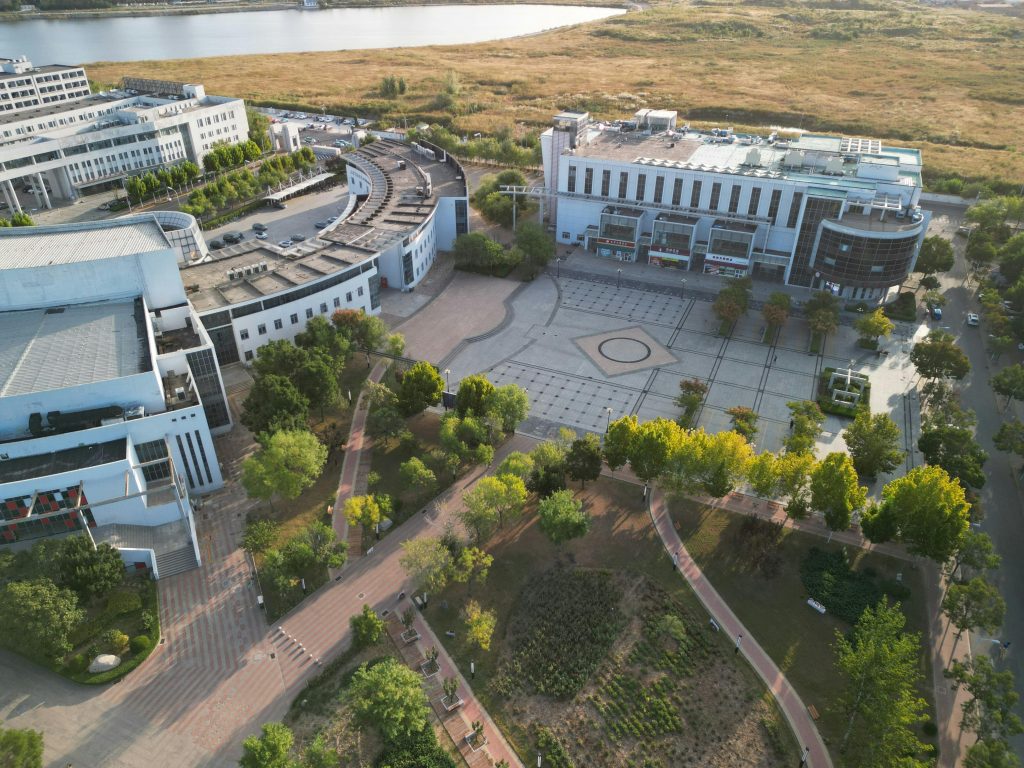 Aerial view showing modern architecture and green spaces in Tianjin, China.